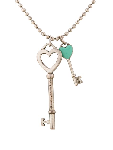 Tiffany & Co Mini Sterling Silver Heart Key Pendant Necklace 16 Chain. . Tiffany key necklaces